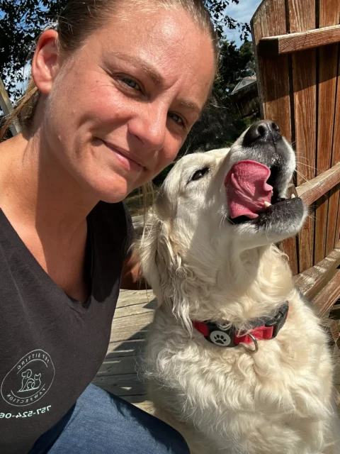 Kirsten, owner of Pet Sitting Pawfection, with dog on walk